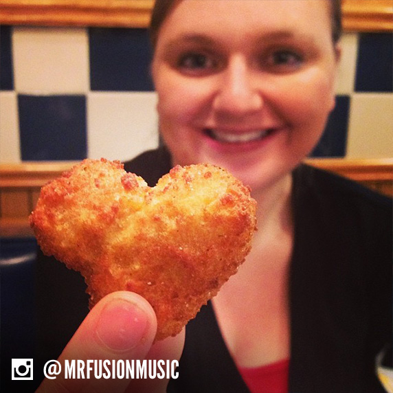 Culver’s guest holding up a heart-shaped Cheese Curd.