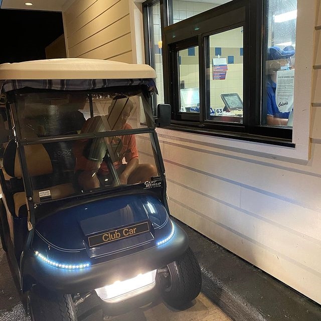 Man in a golf cart in a Culver's drive-thru