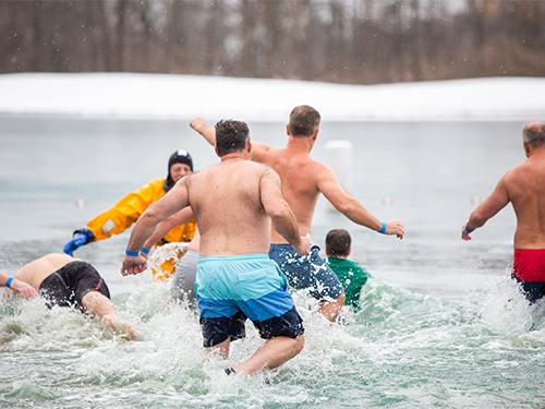 Swimmers in a Wisconsin lake during Winter