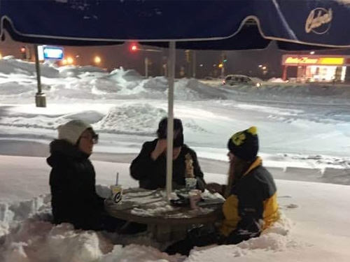 Culver's guests eating outside in the snow