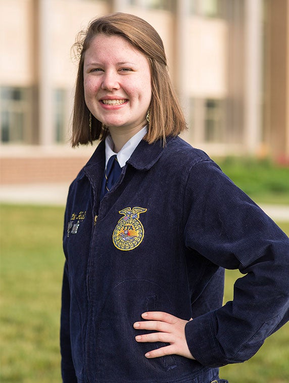 Kaitlyn poses in her FFA blue jacket.