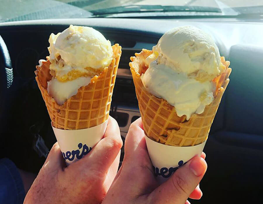 Two waffle cones with vanilla fresh frozen custard