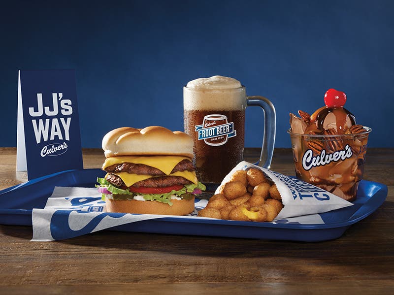 the jj watt meal on a blue tray; a double butterburger, a root beer float, cheese curds, and a sundae