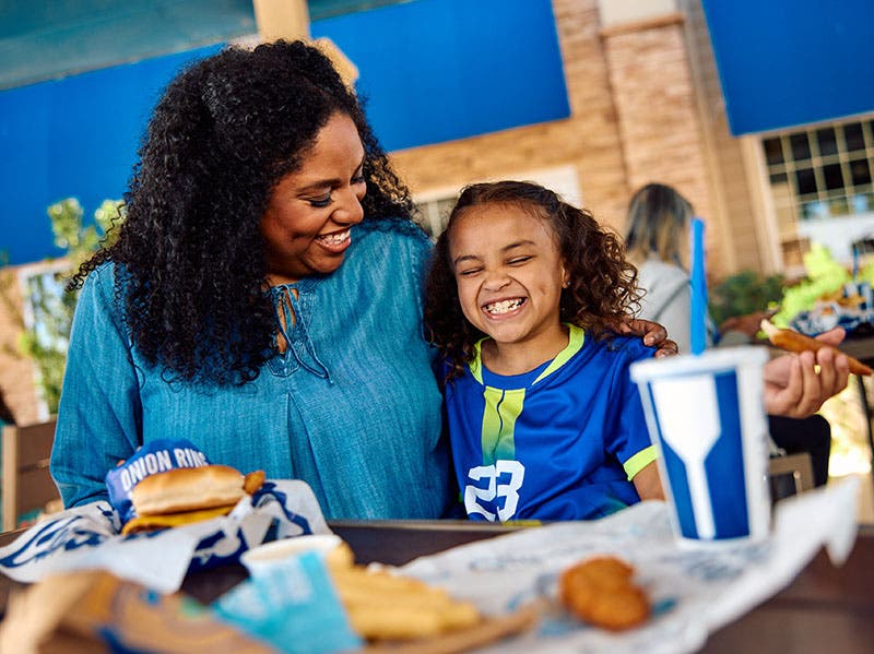 A family enjoying culvers together at a restaurant