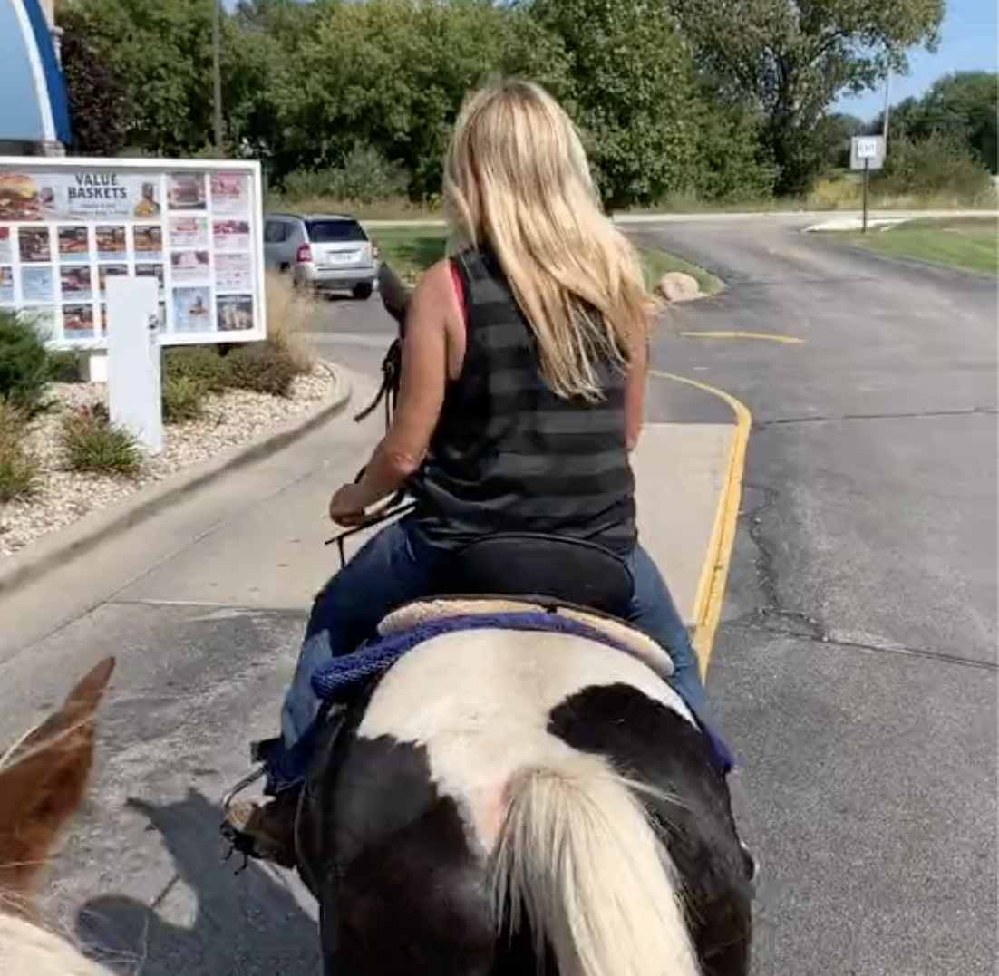 Woman on horse in Culver's drive-thru