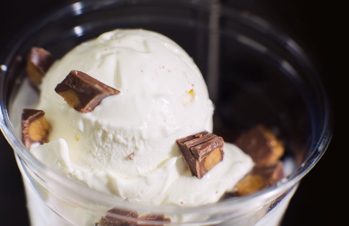 Single scoop of Fresh Frozen Custard topped with Reese's.