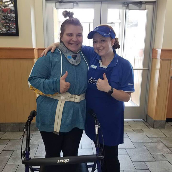 General Manager Chantal stands with a team member who was recovering from a car accident.