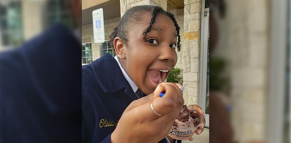 FFA member takes bite of Fresh Frozen Custard.