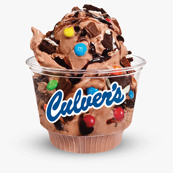 Bite-sized M&Ms, bits of Andes chocolate bars and Oreo chunks are mixed into a single scoop of chocolate frozen custard served in a clear Culver’s dish