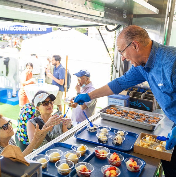 Culver’s guests receiving Fresh Frozen Custard and Cheese Curd samples.