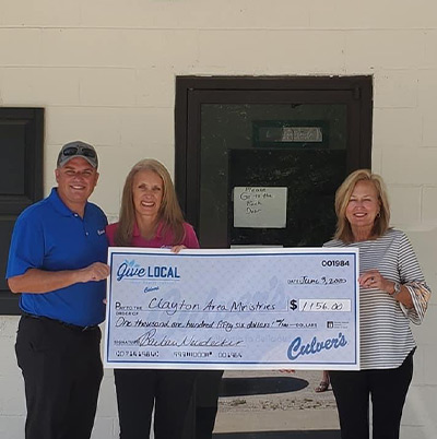 Culver’s presents a donation check to a local food bank.