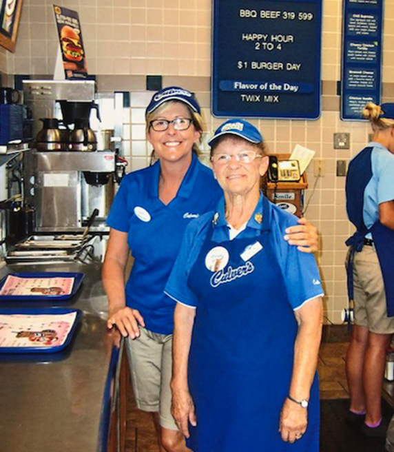 Sharon stands with a team member in the Culver’s restaurant.