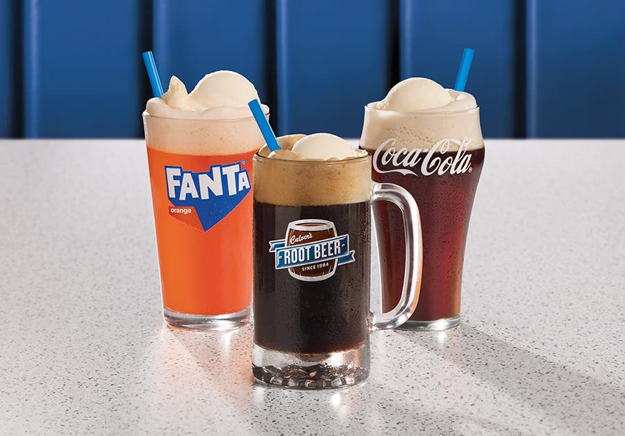 The Culver's collection of three different floats, ready for sipping in a blue booth.