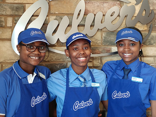 Team members in front of the Culver's logo