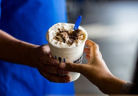 A True Blue Crew member handing off a Concrete Mixer