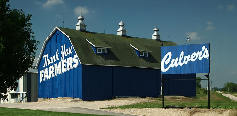 Blue barn with Thank You Farmers painted on the side