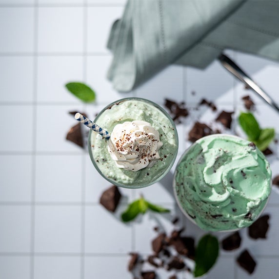 Grasshopper frozen custard mocktail drink with whipped cream on top in a glass