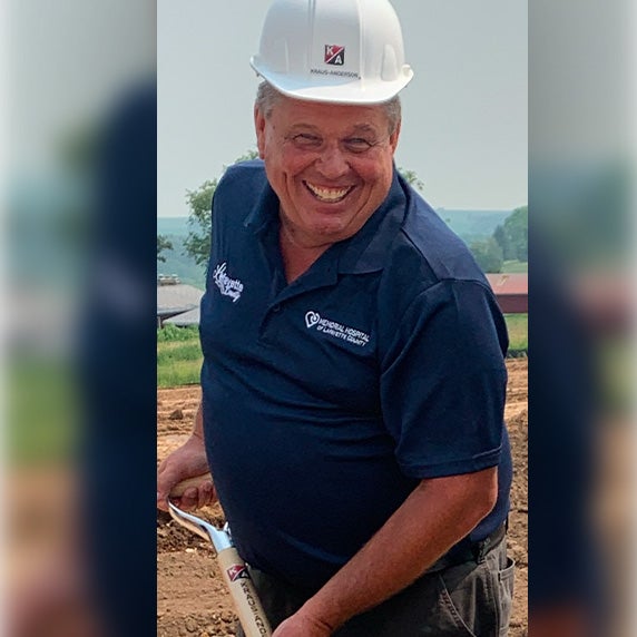 Man with a hard hat smiling