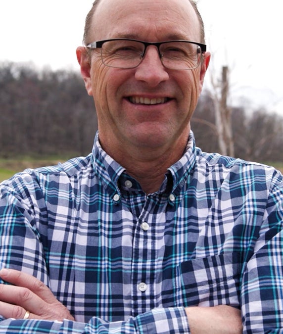 Man with glasses smiling