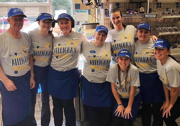 Link to story: Michigan Restaurant is one big family. Team members pose for a photo in the restaurant.