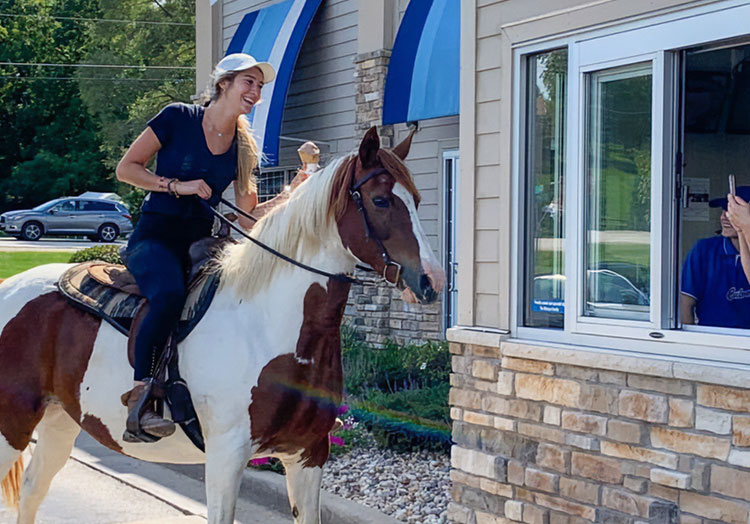 Link to story: Magical moments in the Culver's Drive-Thru. Pictured, a girl riding a horse through the Culver’s Drive-Thru