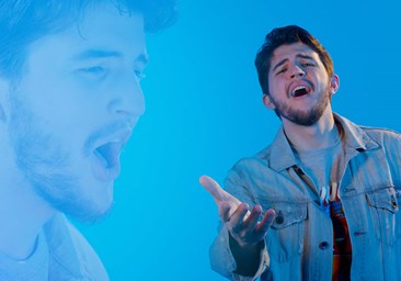 Link to story: Dunked in Love Pretzel Bites Ballad. Person singing with a blue background