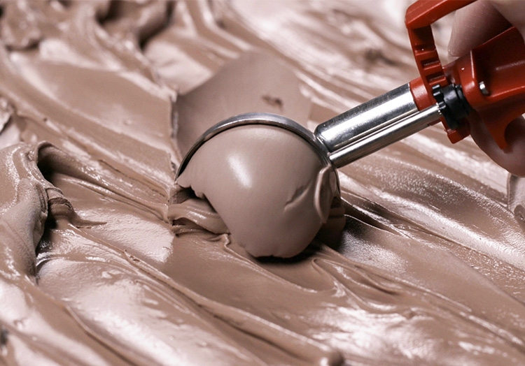 Hand scoops Chocolate Fresh Frozen Custard.
