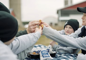 Family cheers-ing with Cheese Curds.