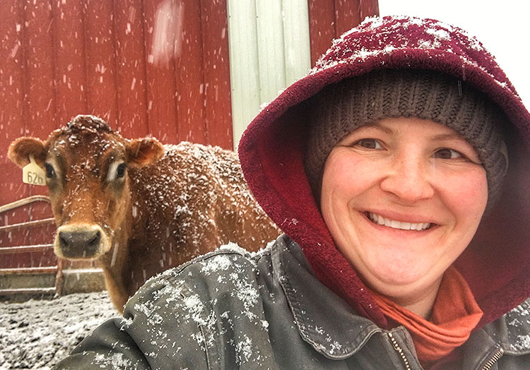 Link to story: Team Member Marie is also a Dairy Farmer. Marie takes a selfie with a cow on a snowy day.