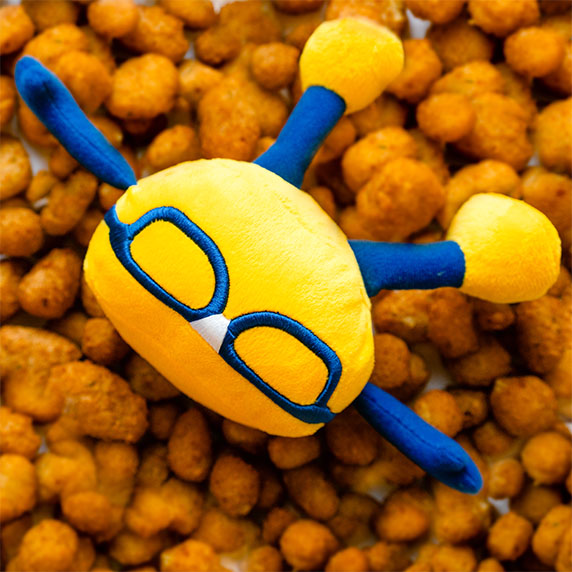 Curdis plushie laying in cheese curds