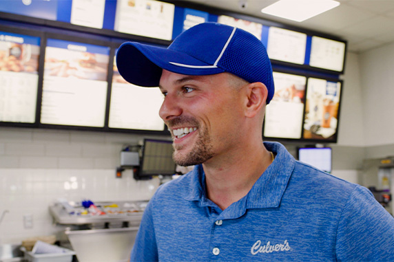 Bobby smiling working at a Culver's restaurant