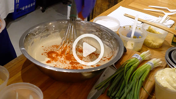 Ingredients for Cheese Curd dipping sauce sit on a table, image links to YouTube video